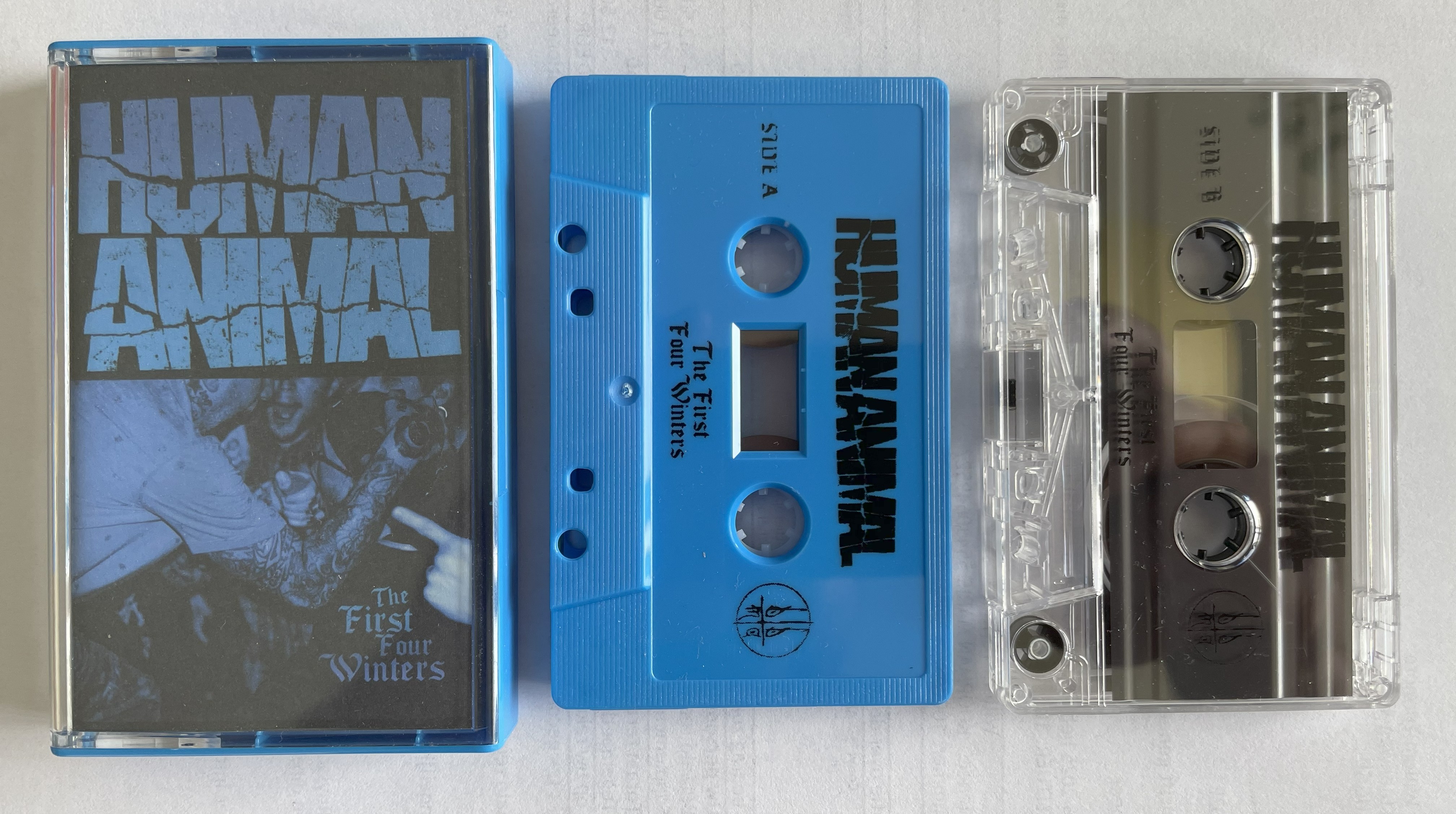 photo of the two human animal the first four winters cassettes